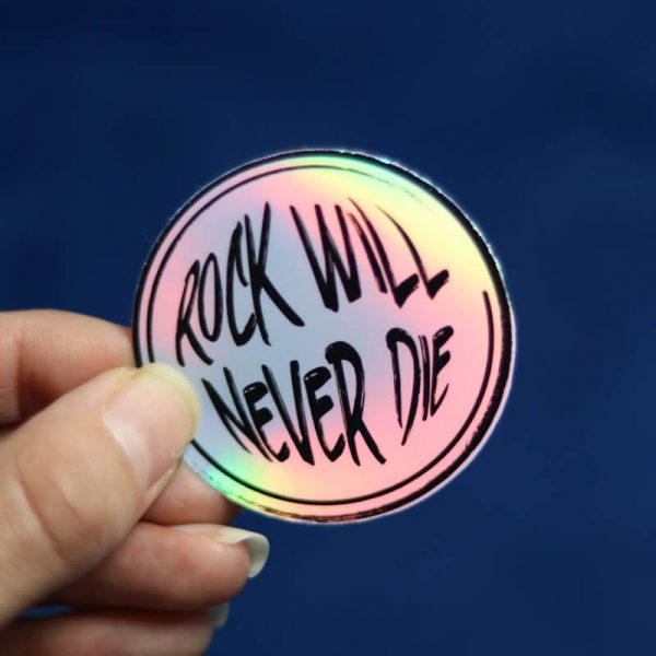 Rock Will Never Die Sticker (Holographic) | Holding with Fingers | Ash Robertson Design